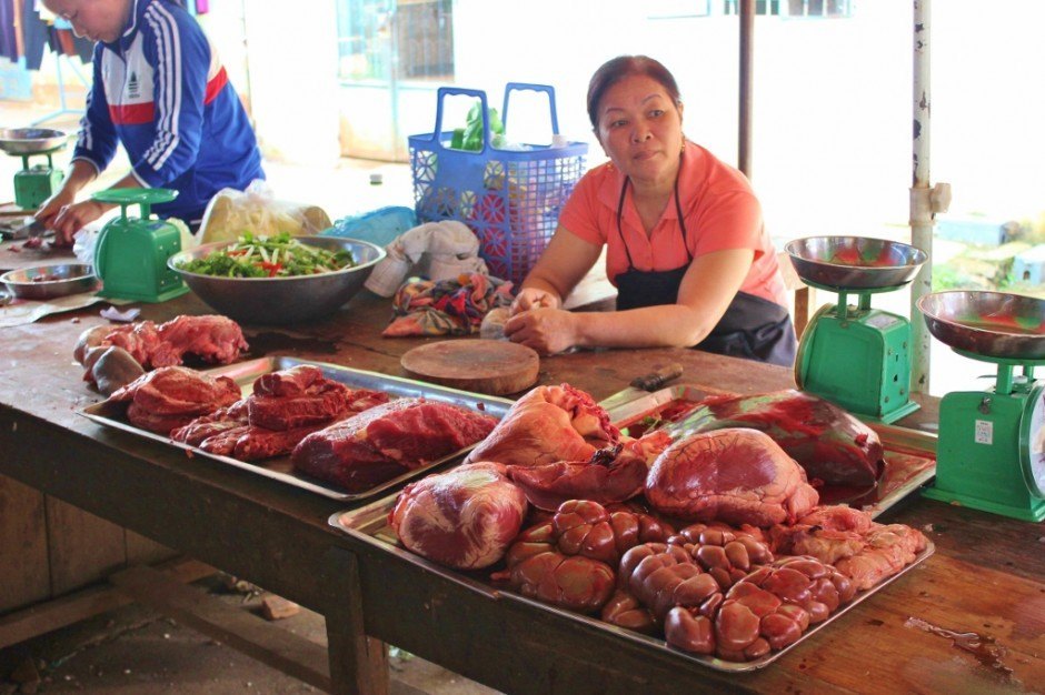 Touring Vietnam's Central Highlands: Long days for this woman ~ she butchers a cow, sells it at the market and then works at a bar at night
