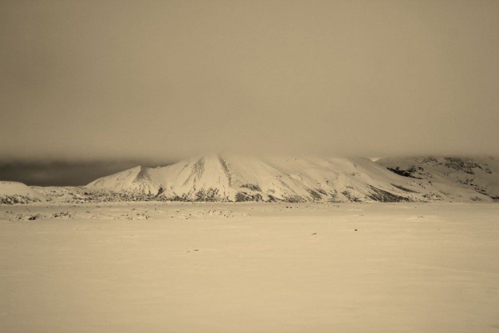 Iceland in Wintertime mountain in the clouds jetSettingFools