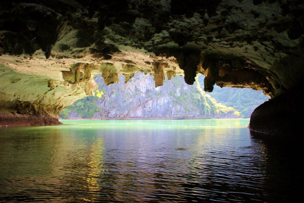 Kayaking through caves on Halong Bay is part of our 2-Week Vietnam Itinerary