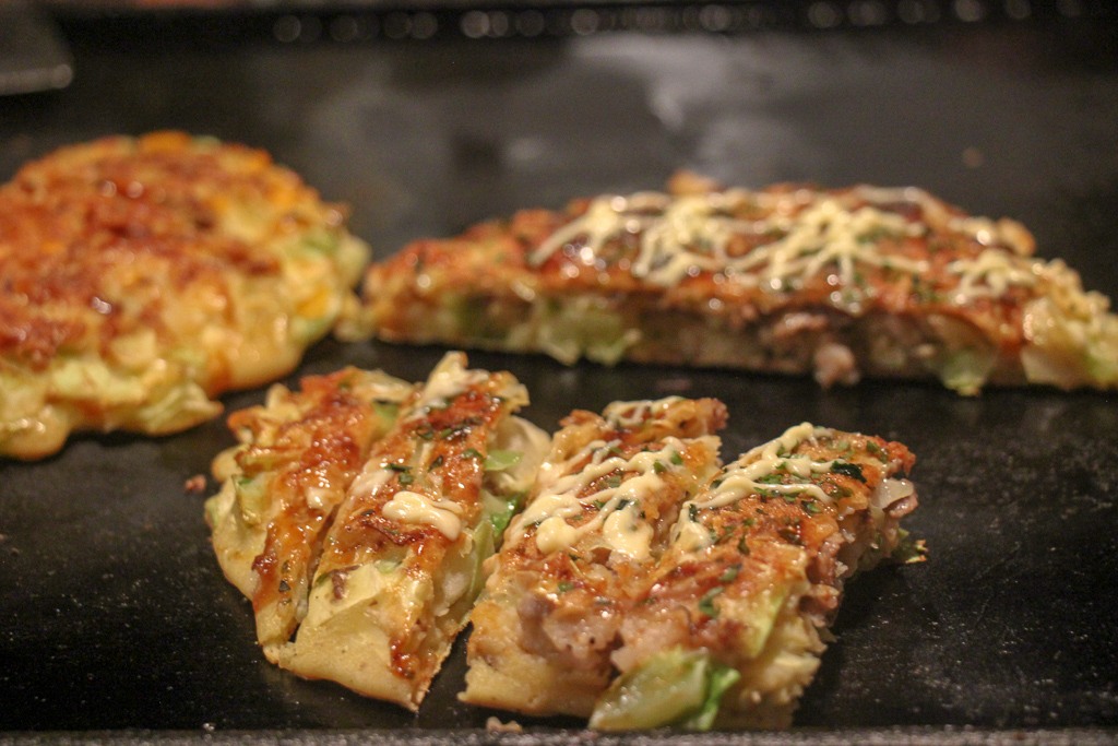 Pieces of cut Okonomiyaki at Sometaro in Tokyo, Japan