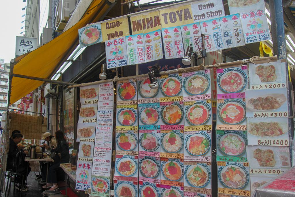 Displayed menu on side of restaurant at Ameyoko Market in Tokyo, Japan